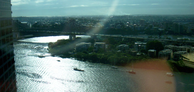 Looking down on the Brisbane River and across to the Story Bridge from a city skyscraper