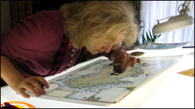Linda Fairbairn checking Australia Map Journal proof prior to printing